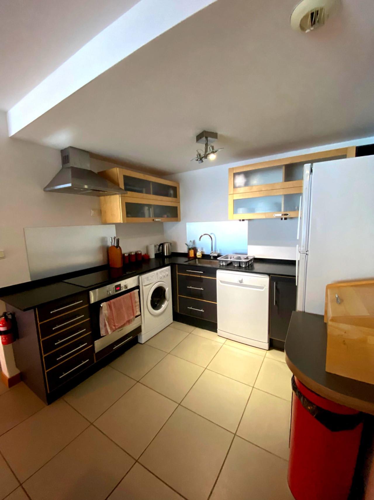 Kitchen. Open plan. Fridge freezer, washing/drying machine, dishwasher, oven and microwave